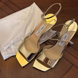 Perfect condition NEW! Box, proof of authenticity Jimmy Choo Gold Sandals.